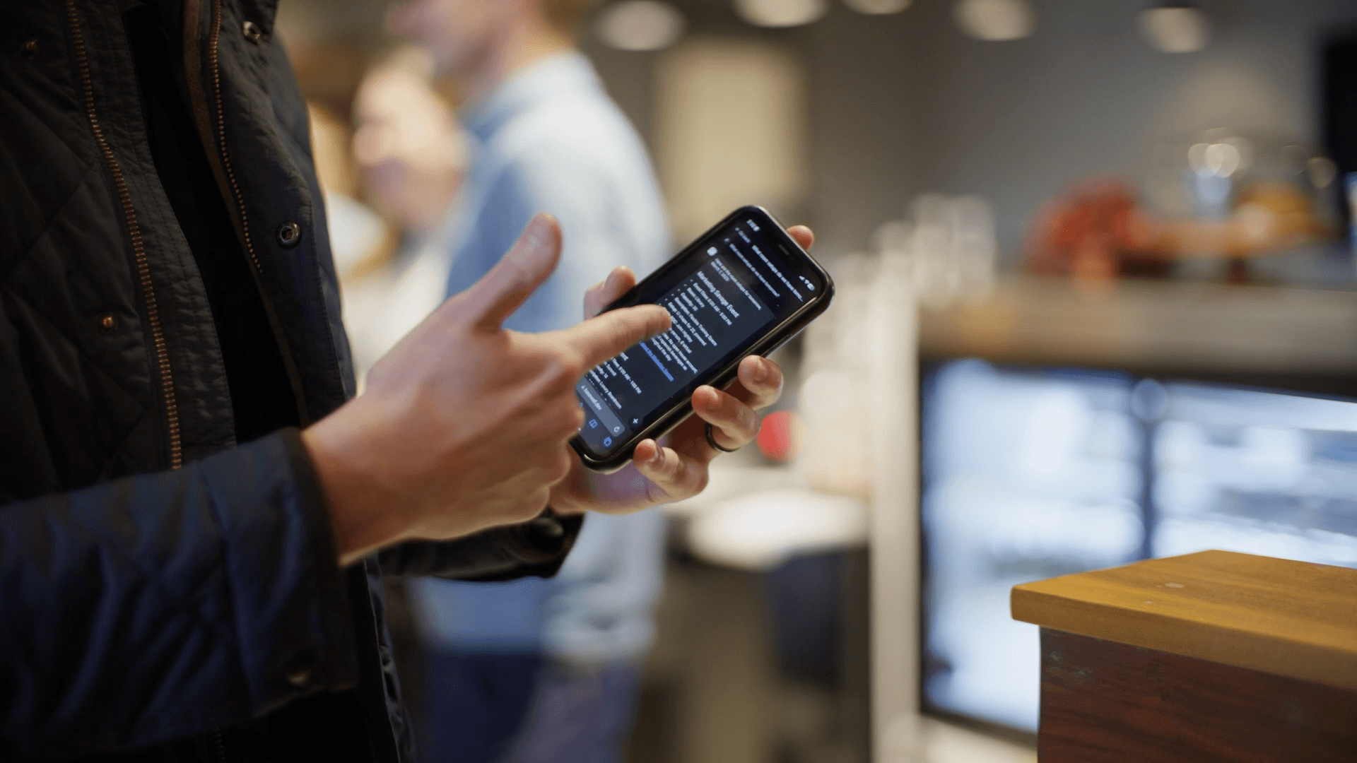 A Roam employee using Basewell on their phone